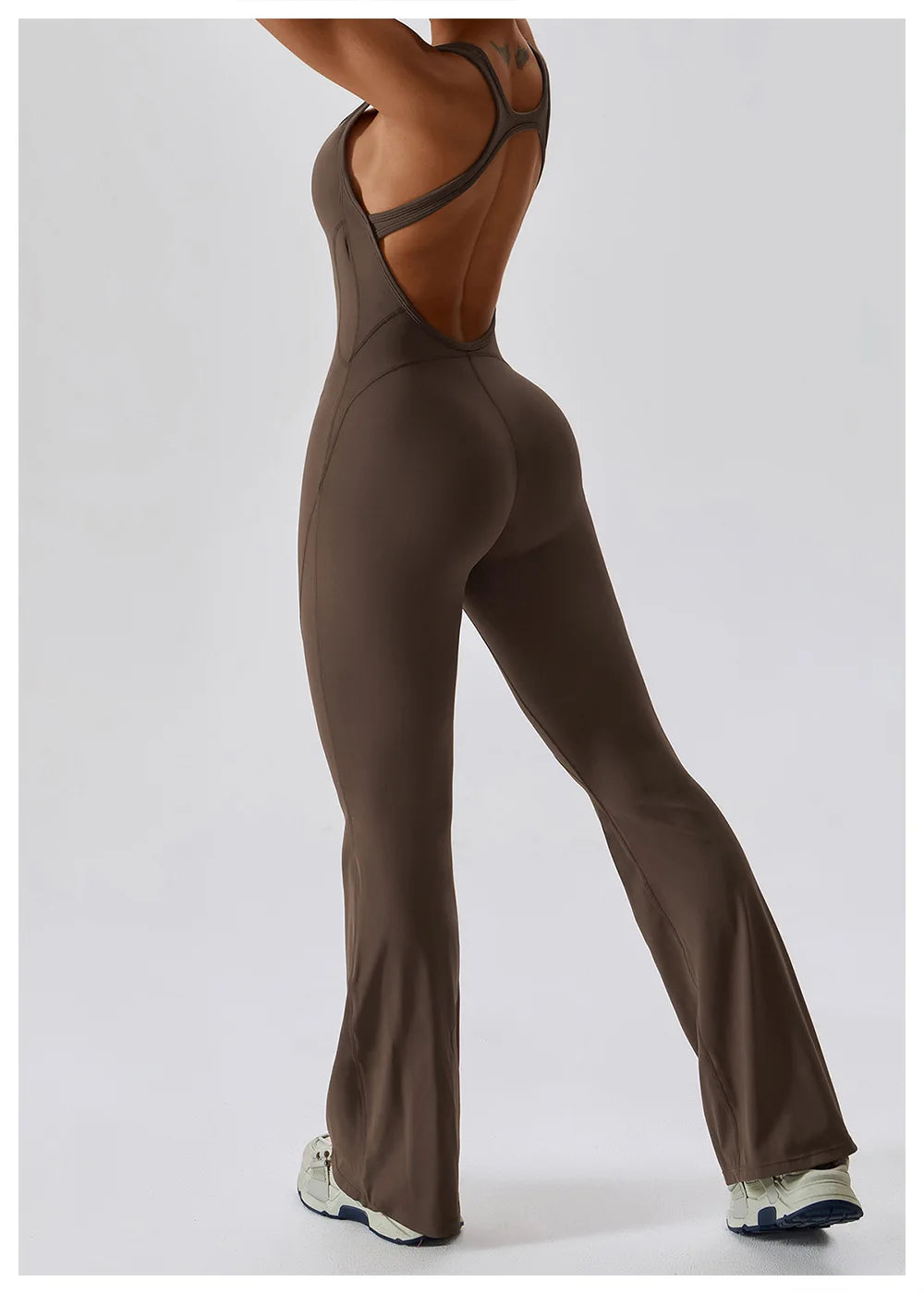Women’s ALMASTRONG sports jumpsuit with stretch fabric, designed for gym, yoga, and fitness workouts, featuring a sleek, fitted bodysuit style.