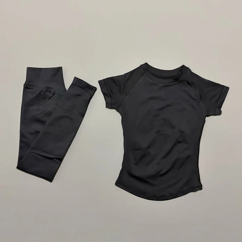 ALMASTRONG 2-piece impact sports set with short sleeve seamless yoga top and matching fitness leggings for women’s workout and running.