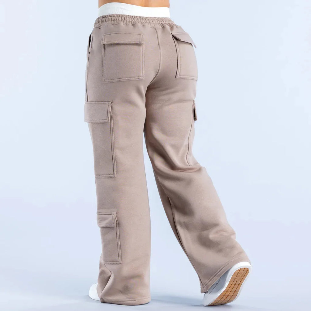 Women’s wide-leg cargo pants by ALMASTRONG featuring high-waist streetwear utility design with multiple pockets and relaxed fit.