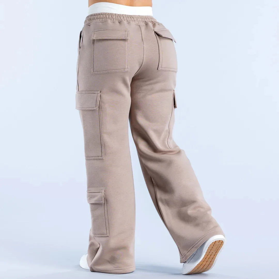 Women’s wide-leg cargo pants by ALMASTRONG featuring high-waist streetwear utility design with multiple pockets and relaxed fit.