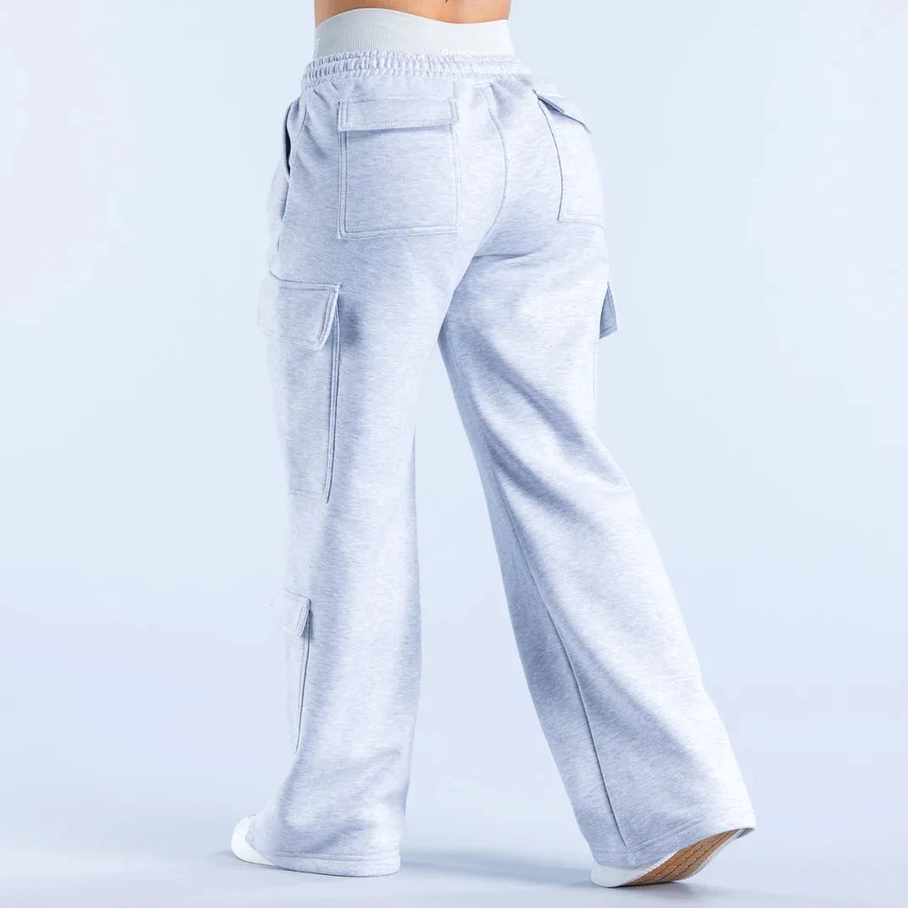 Women’s wide-leg cargo pants by ALMASTRONG featuring high-waist streetwear utility design and multiple functional pockets.