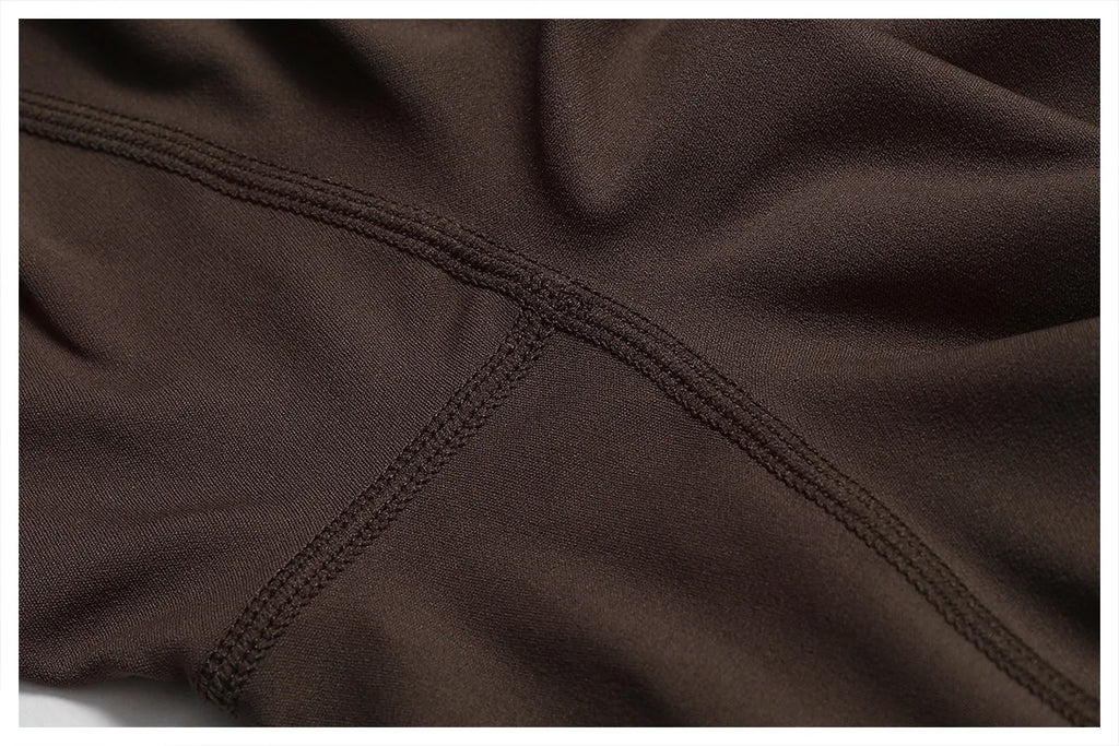 ALMASTRONG women’s sports jumpsuit with stretch fabric, ideal for gym, yoga, and fitness workouts, featuring a sleek, form-fitting design.