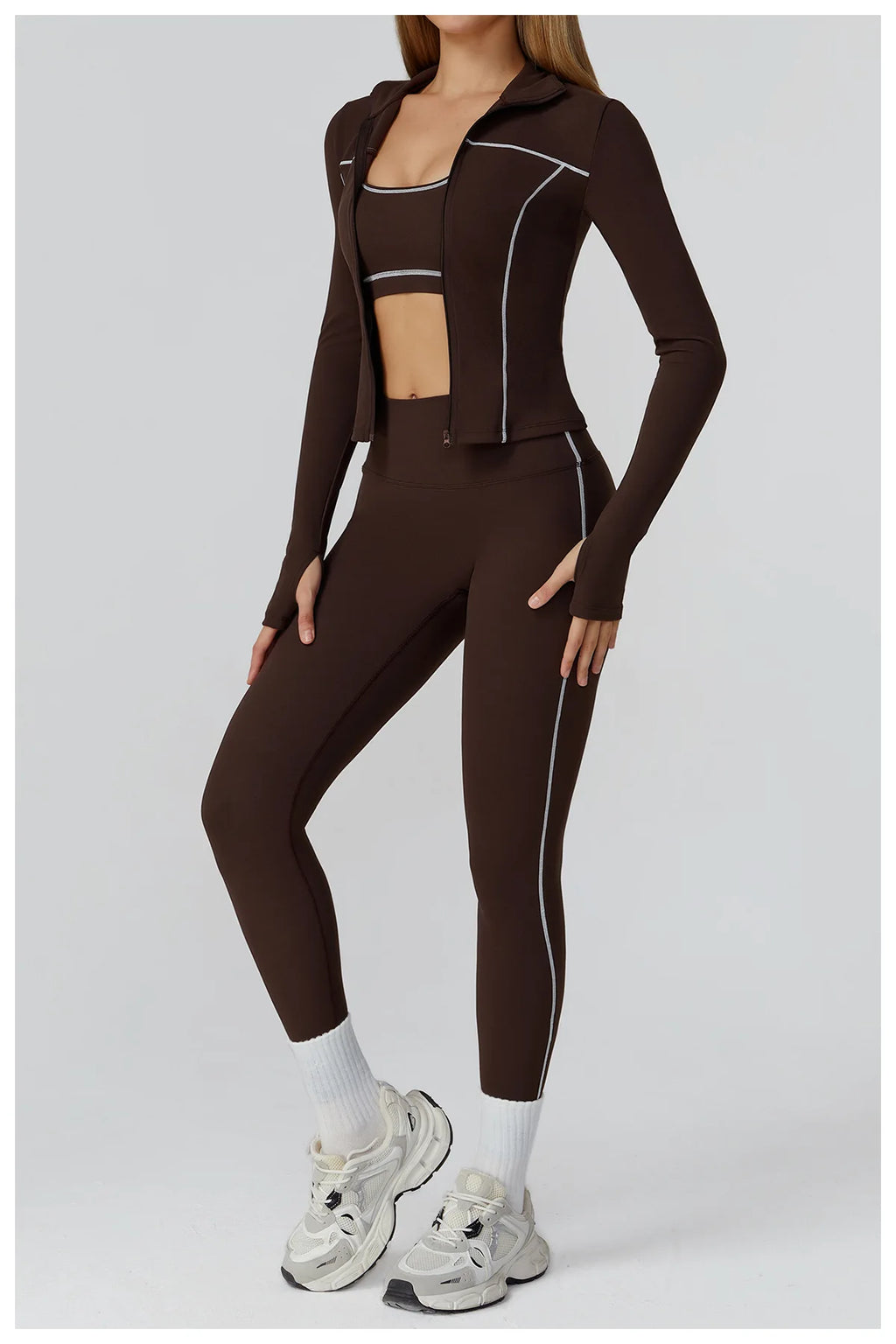 AlmaStrong women's yoga set with long-sleeve top, leggings, and sports bra for fitness and workout activities.