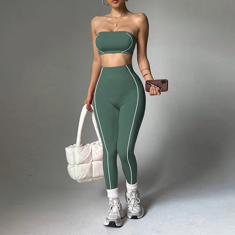 Women's yoga wear set by ALMASTRONG featuring a color-blocking corset top and slim-fit peach long pants for fitness.