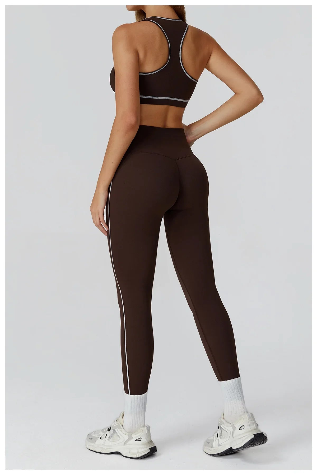 ALMASTRONG women's yoga set with long-sleeve top, leggings, and sports bra for fitness and workout activities.