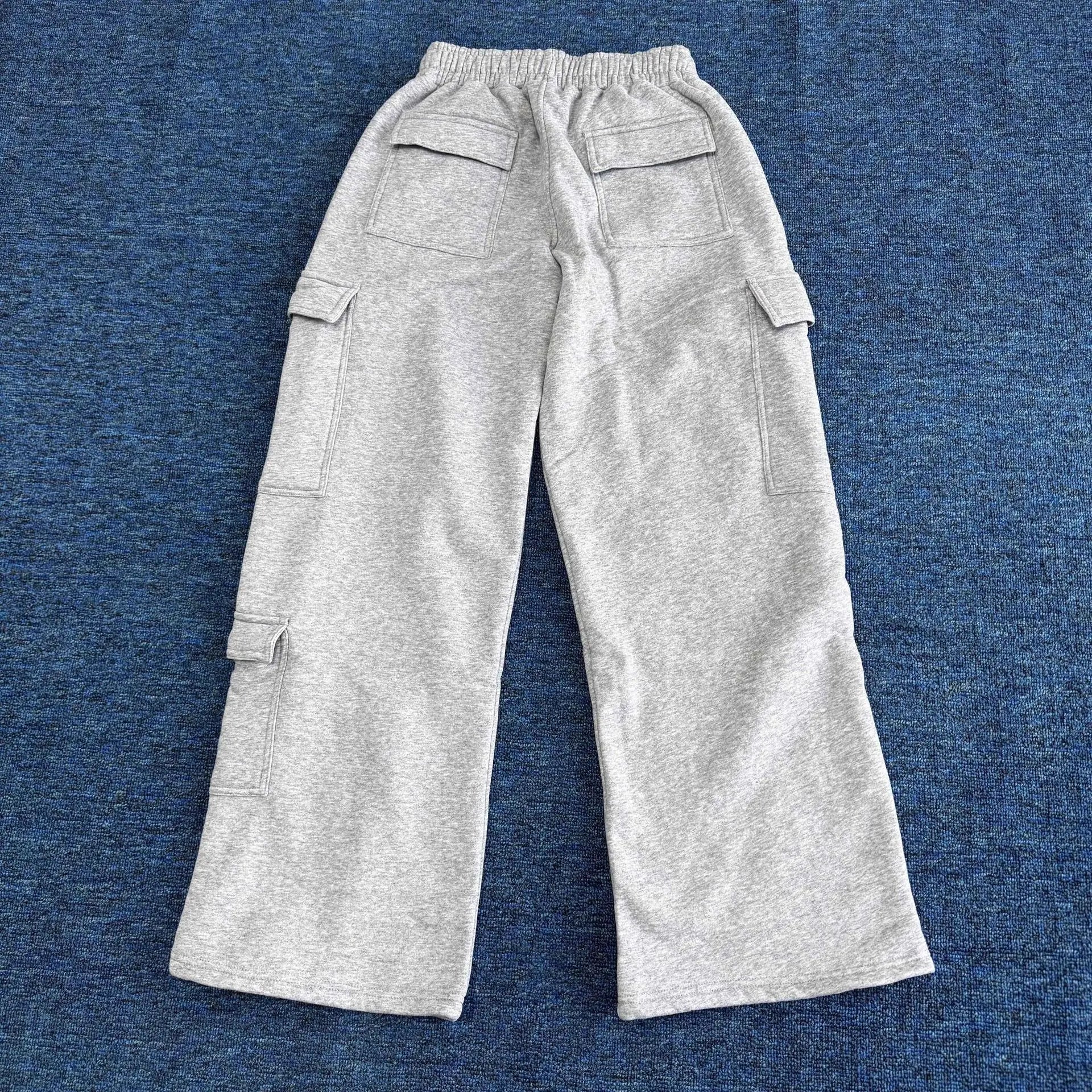 Women’s wide-leg cargo pants by ALMASTRONG featuring high-waist streetwear utility trousers with multiple pockets and relaxed fit.