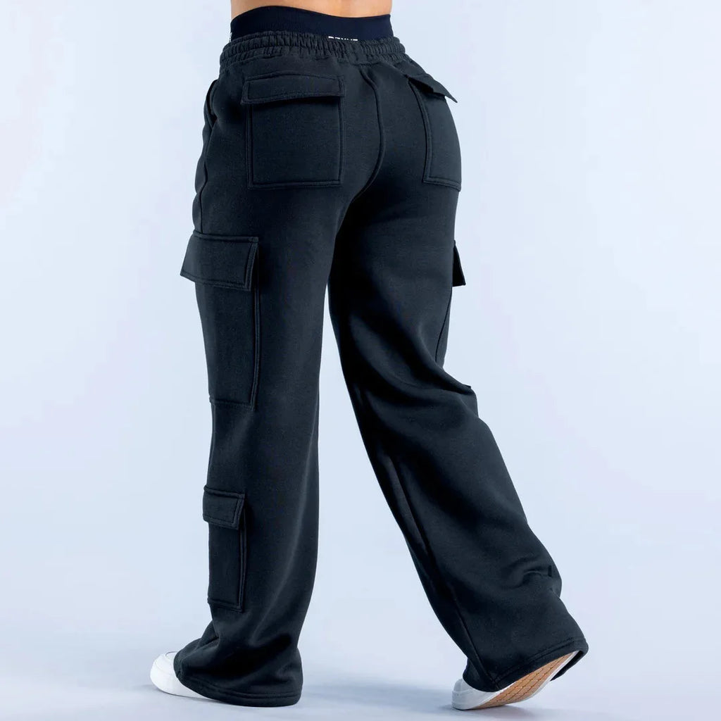 Women’s high-waist wide-leg cargo pants from ALMASTRONG featuring streetwear-inspired utility design and multiple large pockets.