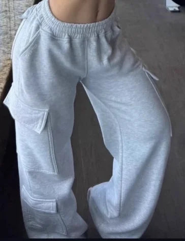 Women’s wide-leg cargo pants by ALMASTRONG featuring high-waist streetwear utility design and multiple cargo pockets.