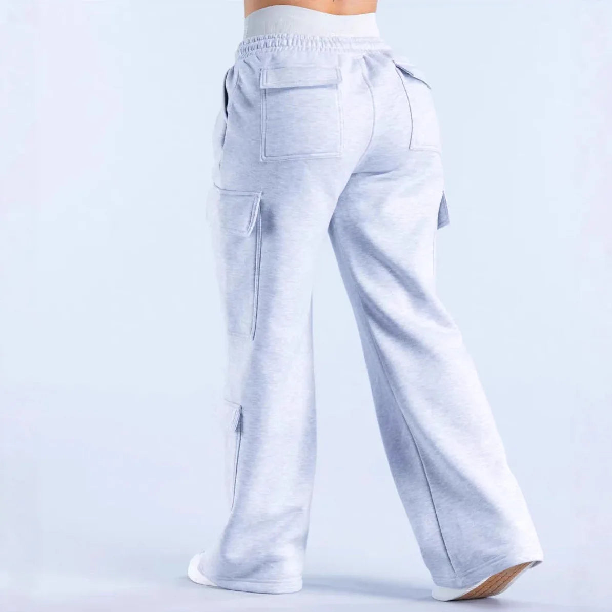 Women’s high-waist wide-leg cargo pants by ALMASTRONG featuring streetwear utility design and multiple pockets.