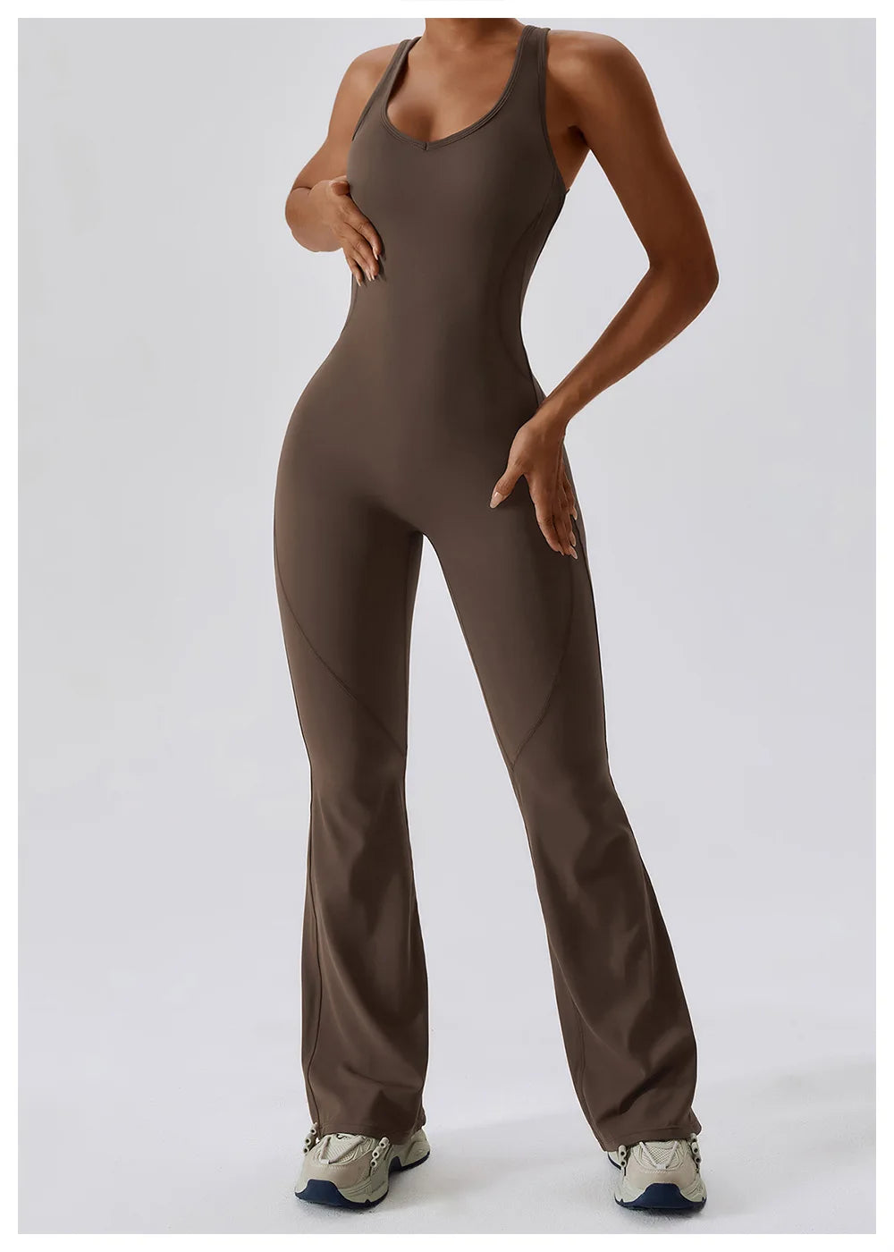 Women’s ALMASTRONG sports jumpsuit and yoga set, stretchy gym romper for fitness, training, and workout sessions.