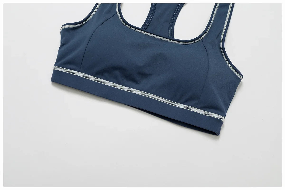 ALMASTRONG women's yoga set with long-sleeved top, leggings, and sports bra for fitness and workout activities.