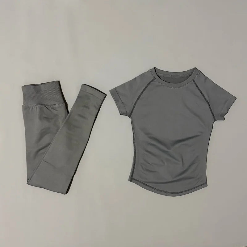 ALMASTRONG 2-piece impact sports set with short sleeve seamless yoga top and workout leggings for women’s fitness and running.