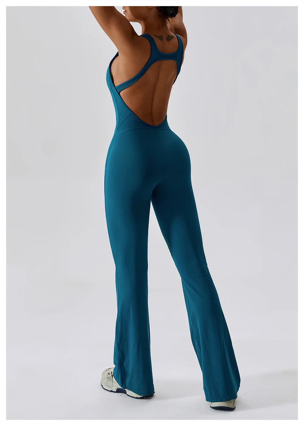 Women’s ALMASTRONG sports jumpsuit and yoga romper, stretchy fitness gym set for training, workout, and yoga sessions.